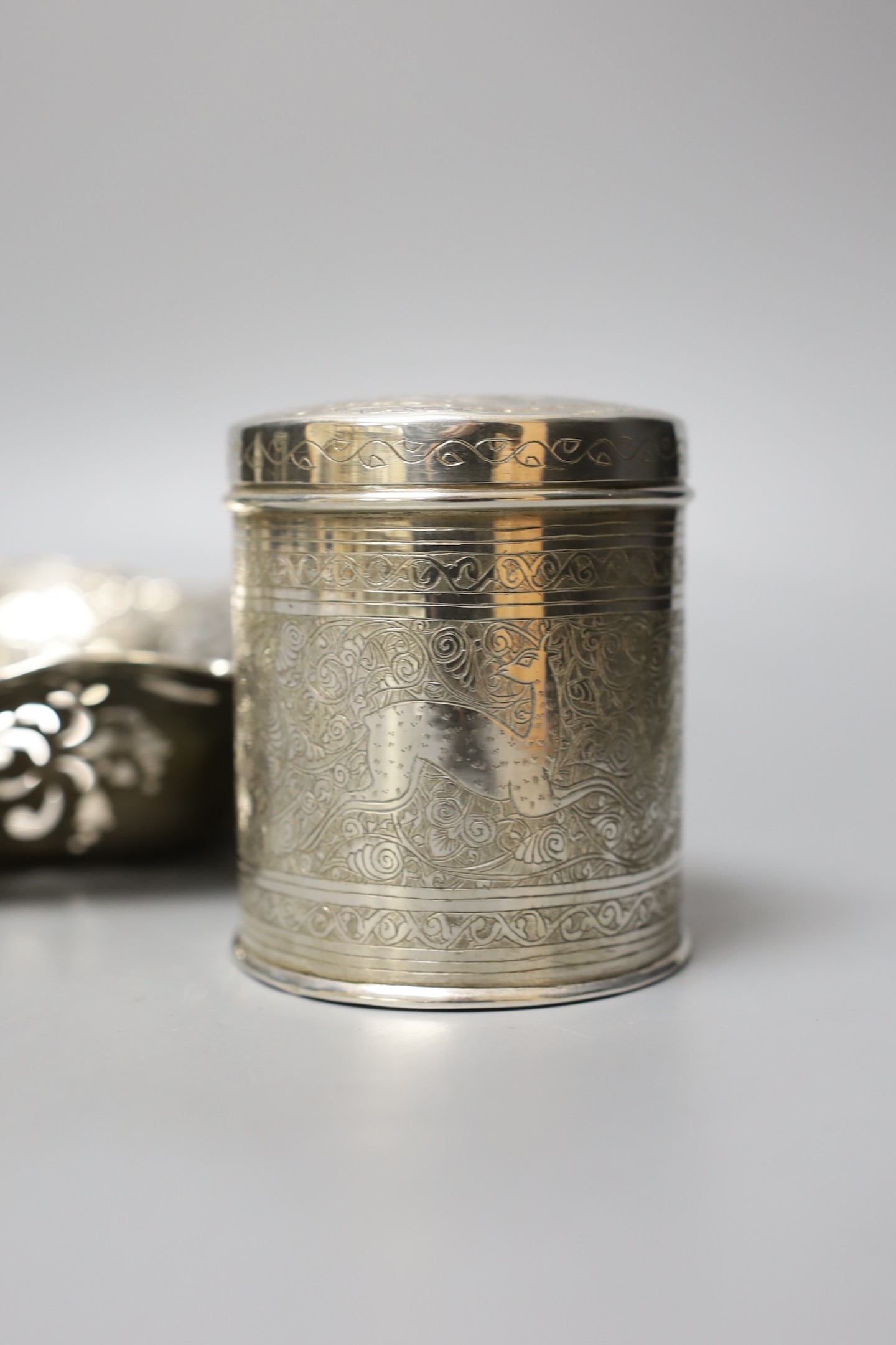 An American pierced sterling bowl, by Caldwell & Co, 28.5cm, a 1960's small silver armada dish and an Egyptian white metal canister and cover